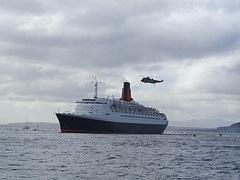 HMS Manchester escorted QE2 into Greenock and a Sea King helicopter, and press helicopters, hovered overhead.